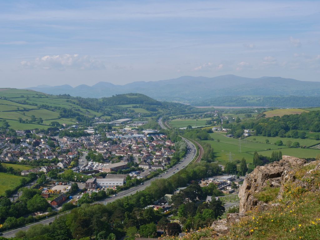 Aerial view of A55 motorway and Snowdonia mountains in North Wales